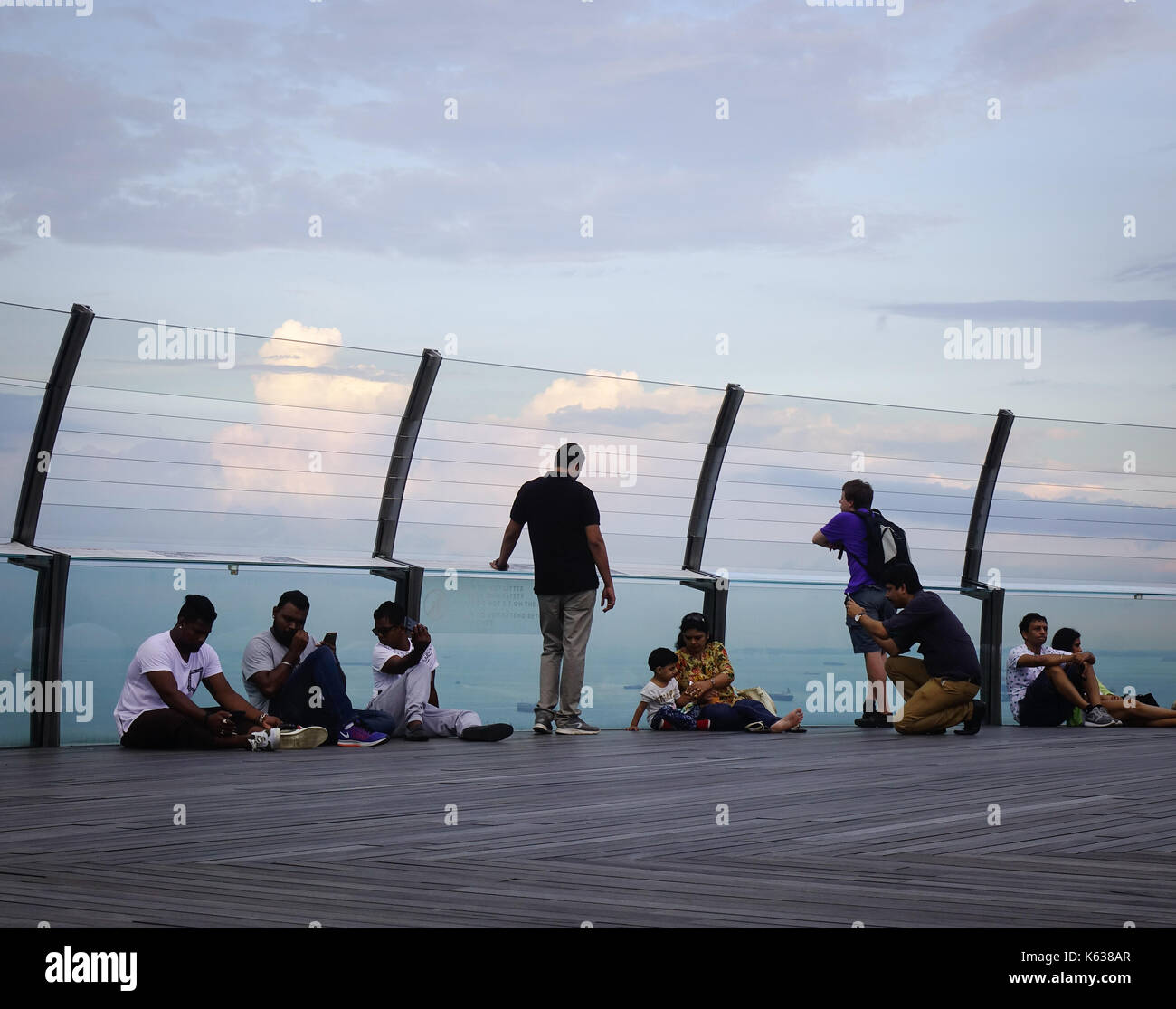 people relaxing on SkyPark observation deck